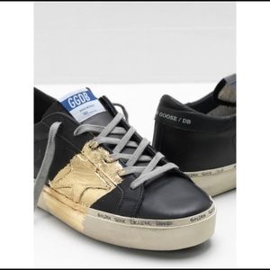 Black and gold golden goose sneakers
